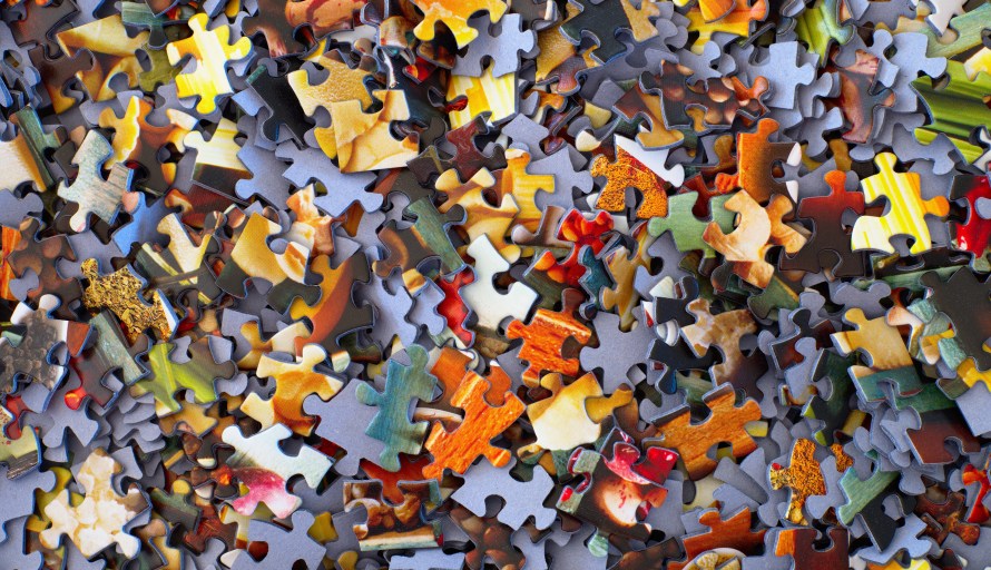 A pile of colorful jigsaw pieces